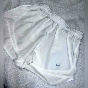White Nike running shorts